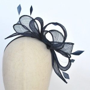 Navy Blue Sinamay Fascinator with Loops and Feathers worn to the left of the head