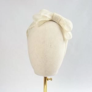 Ivory Large Sinamay Bow Fascinator - Front view of fascinator, worn to the left