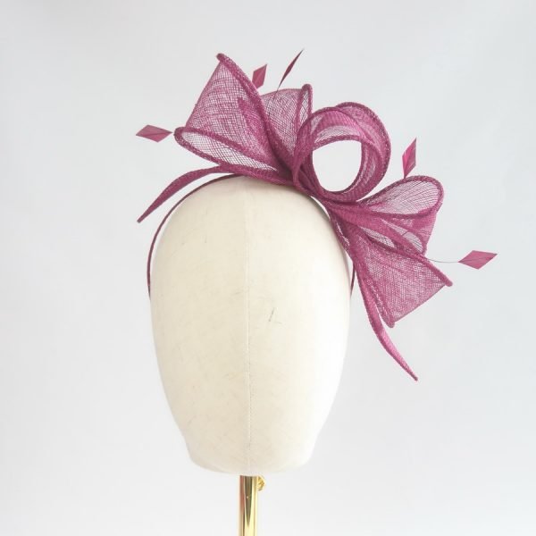 Wine Red Loop Fascinator with Coque Feathers, worn to the left