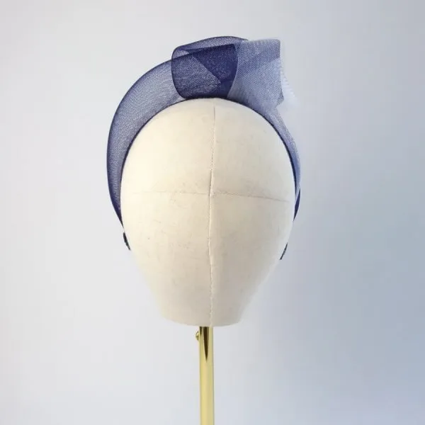 Back view of a Navy White Mesh Knotted Headband worn to the right of the head