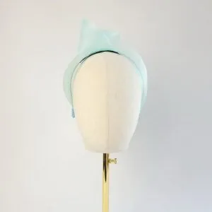 Aqua Blue Crinoline Knot Headband worn to the right of the head