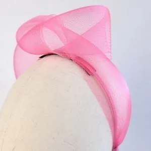 Detail of Fuchsia Crinoline Knot Headband worn to the left of the head