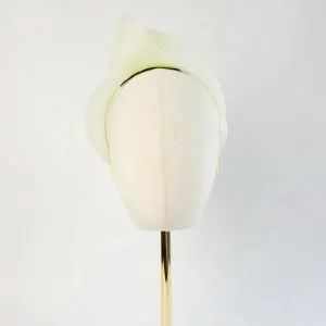 Pale Yellow Crinoline Knot Headband worn to the right of the head