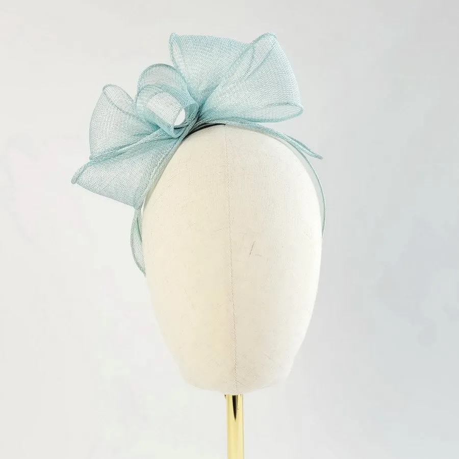 Aqua Blue Looped Fascinator Headband worn to the right of the head