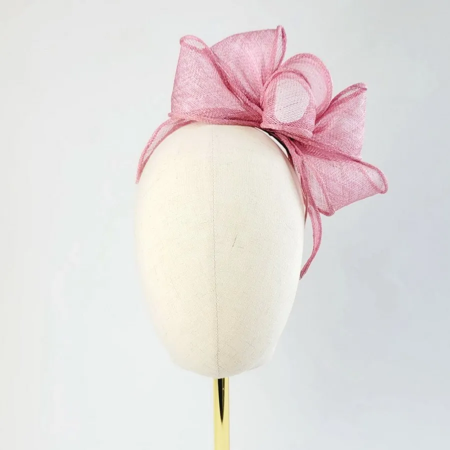 Dusky Pink Looped Fascinator Headband worn to the left of the head