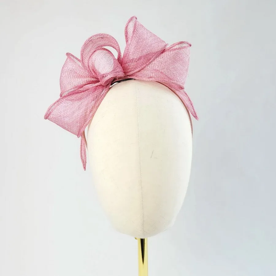 Dusky Pink Looped Fascinator Headband worn to the right of the head
