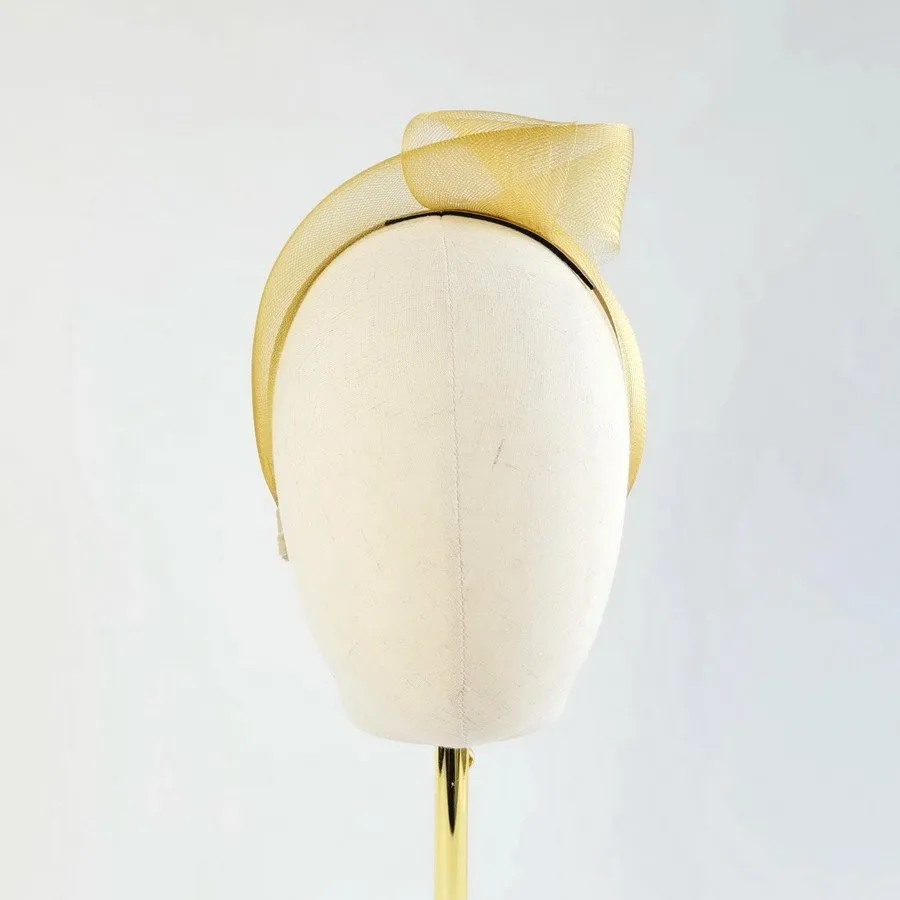 Mustard vegan friendly knotted headband worn to the left of the head