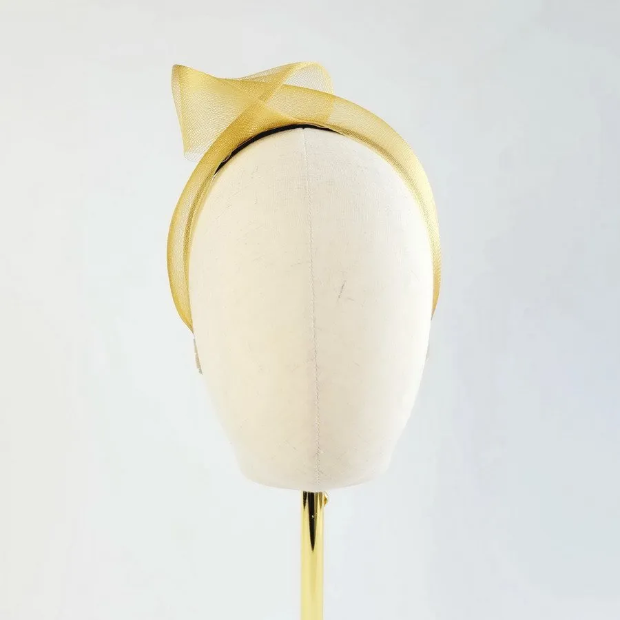 Mustard Yellow Crinoline Knot Headband worn to the right of the head