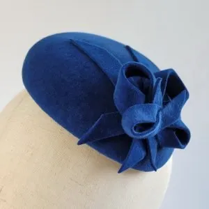 Detail of Royal Blue Winter Wedding Hat worn to the left of the head