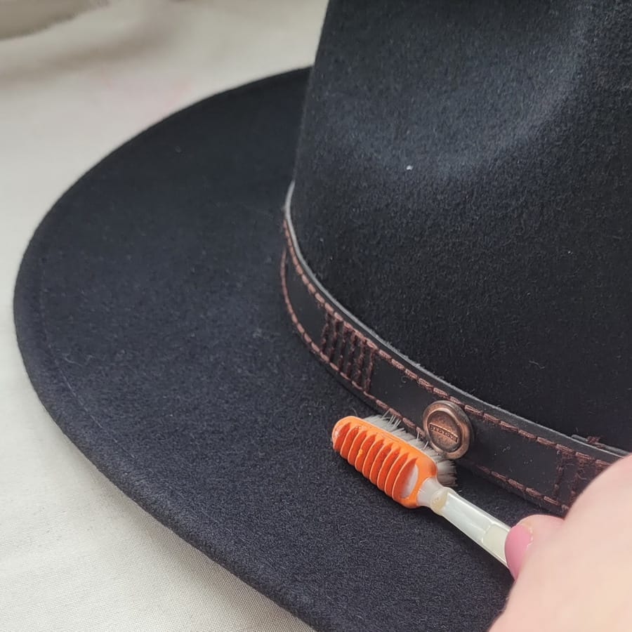 Topical brushing of a felt hat with an old toothbrush