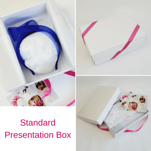 Royal Blue Crinoline Knot Headband in standard white presentation box with pink ribbon