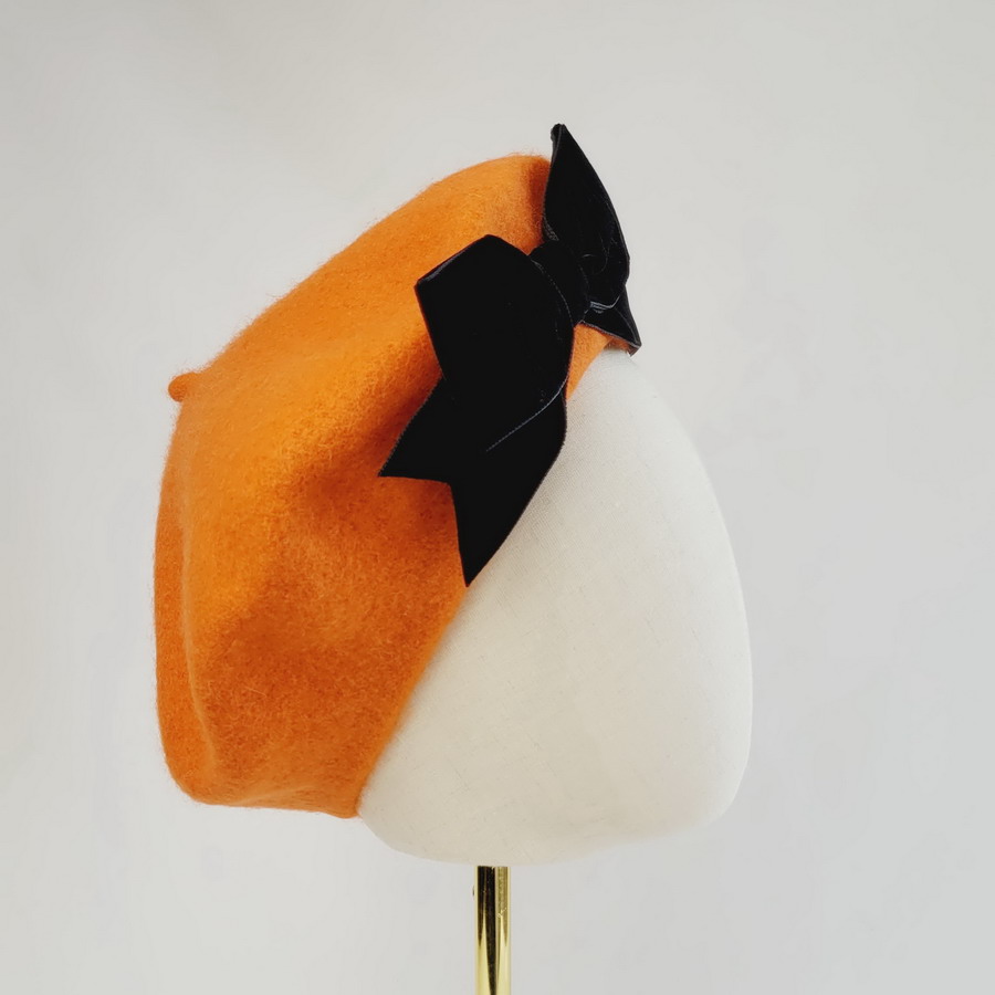 Orange wool winter hat with bow