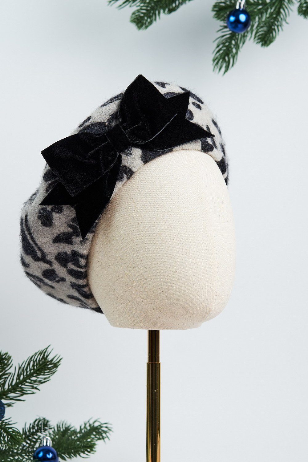 Shop the New AW22 Beret Collection featuring this Grey Leopard Print Wool Felt Beret with a hand sewn Black Velvet Ribbon Bow made by Imogen's Imagination